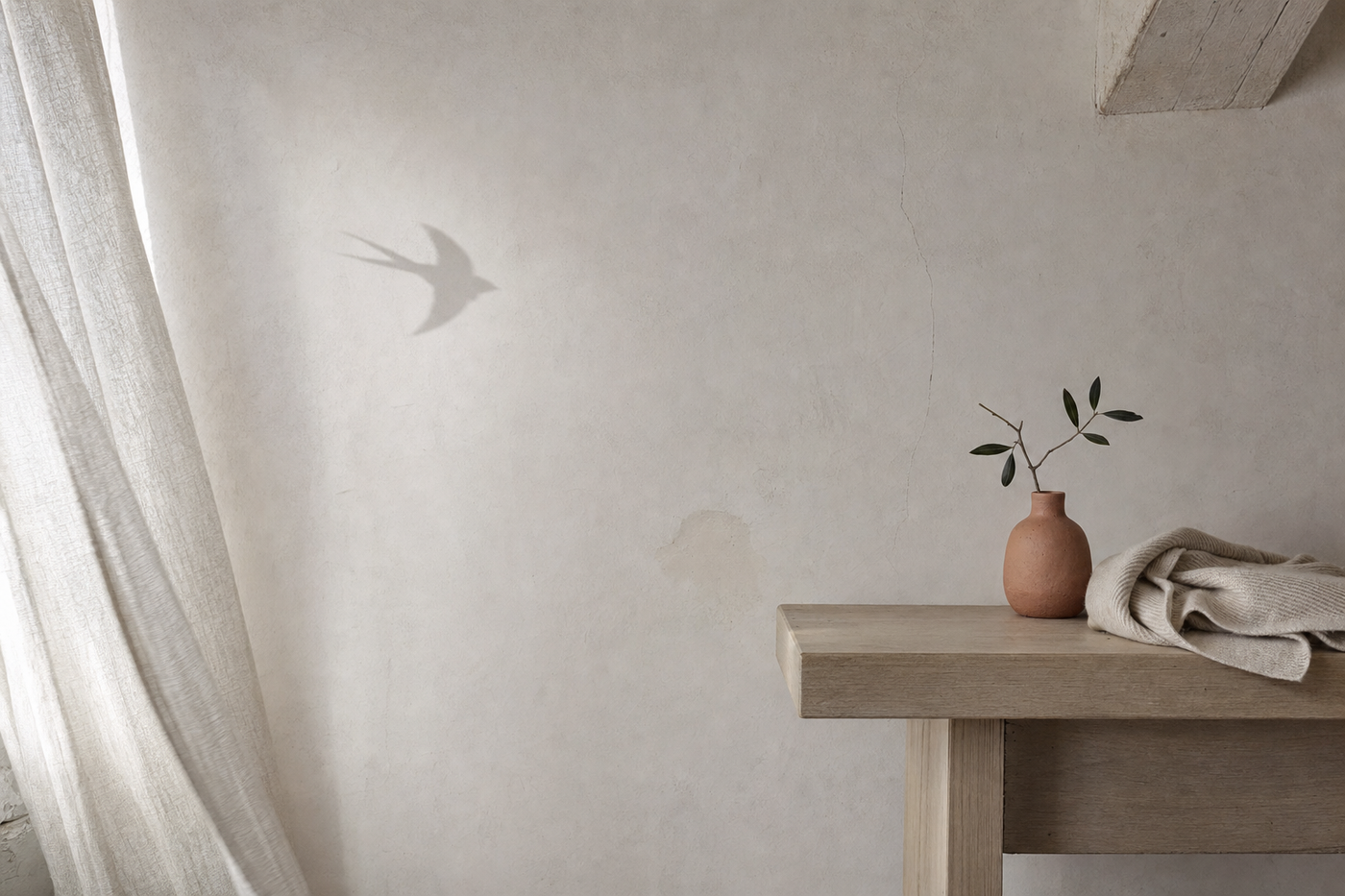 Oreneta purpose — Mediterranean home cool morning, swallow shadow on cream wall, ceramic vase with olive branch